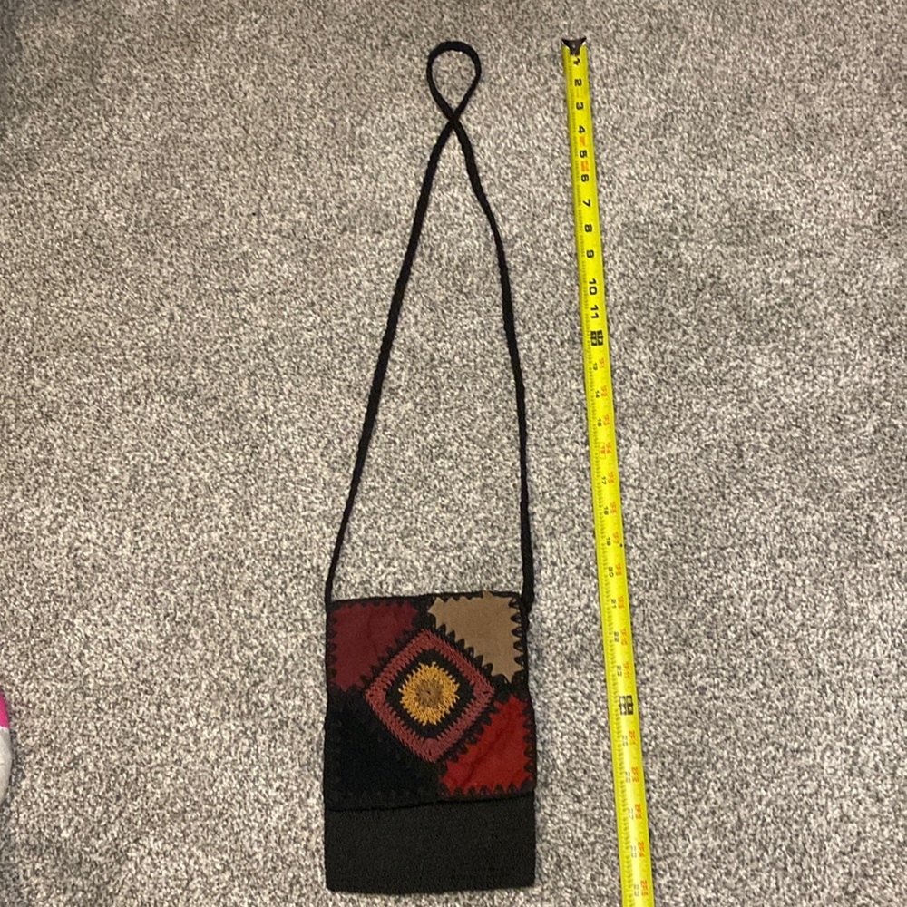 Crossbody purse black crochet with suede patches.